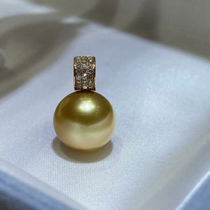 pearl pendant with diamonds around it