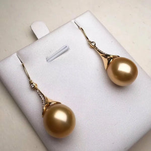 big pearl hanging earrings