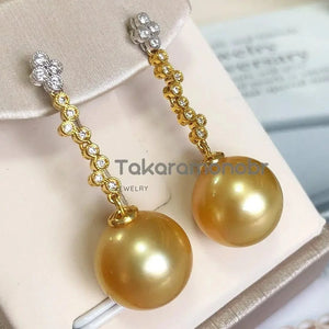 pandora golden pearl earrings