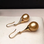 Load image into Gallery viewer, golden cultured round pearl hoop earrings
