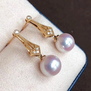 rounf white pearl earrings