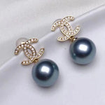 Load image into Gallery viewer, silver blue Tahitian pearl earrings with 18k gold and diamond
