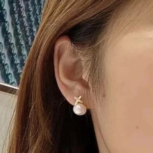 stud earrings in ear